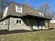 This beautiful home features stone accents, a covered porch, and a well-maintained lawn at 8468 N Baltimore Rd, Monrovia, IN 46157