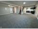 Spacious open-concept living room with new carpeting and modern finishes leading to a well-equipped kitchen at 8468 N Baltimore Rd, Monrovia, IN 46157