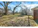 Backyard featuring mature trees and a detached garage at 8525 Edith St, Martinsville, IN 46151