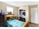 Cozy bedroom with natural light, hardwood floor, and a closet with ample storage space at 8525 Edith St, Martinsville, IN 46151
