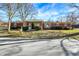 Charming brick ranch home with mature trees and a well-maintained front yard under a bright blue sky at 8525 Edith St, Martinsville, IN 46151