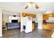 Open kitchen layout flowing into the living room, featuring light wood cabinets and stainless steel appliances at 8525 Edith St, Martinsville, IN 46151