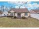 Manicured backyard, patio with dining set, and well-maintained home exterior at 9694 River Oak E Ln, Fishers, IN 46038