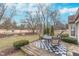 Outdoor deck with mature landscaping and dining set at 9694 River Oak E Ln, Fishers, IN 46038