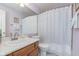 Neutral bathroom with a vanity, mirror, and a shower with a curtain at 9694 River Oak E Ln, Fishers, IN 46038