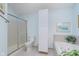 Bright bathroom with a glass-enclosed shower and a jacuzzi tub at 9694 River Oak E Ln, Fishers, IN 46038