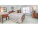 Bright bedroom with light blue walls, decorative framed art, and natural light from the window at 9694 River Oak E Ln, Fishers, IN 46038