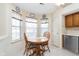 Charming breakfast nook with large windows, a cozy table, and direct access to the kitchen at 9694 River Oak E Ln, Fishers, IN 46038