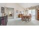 Elegant dining area with a chandelier, sliding doors to the patio, and access to the living room at 9694 River Oak E Ln, Fishers, IN 46038