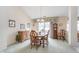 Bright dining room featuring a chandelier, a classic dining table, and large sliding glass doors at 9694 River Oak E Ln, Fishers, IN 46038
