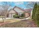 Charming single-story home with well-maintained lawn, brick accents, and attached two-car garage at 9694 River Oak E Ln, Fishers, IN 46038