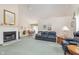 Spacious living room boasts vaulted ceilings, fireplace, and ample natural light at 9694 River Oak E Ln, Fishers, IN 46038