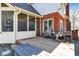 Back porch with rocking chairs and outdoor seating, perfect for enjoying the scenery at 11850 Deer Walk Dr, Cicero, IN 46034
