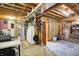 Unfinished basement area with exposed beams and utilities, offering ample storage and potential for customization at 11850 Deer Walk Dr, Cicero, IN 46034