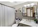 Well-lit bathroom with a tiled wall, framed mirror, and modern fixtures at 11850 Deer Walk Dr, Cicero, IN 46034