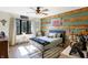 Fun bedroom featuring a bed, unique wood and painted accent walls, and natural light at 11850 Deer Walk Dr, Cicero, IN 46034
