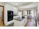 Modern kitchen features white cabinets, a granite-topped island with cooktop, and stainless appliances at 11850 Deer Walk Dr, Cicero, IN 46034
