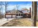 Back exterior view with a three-car garage, screened-in porch, brick chimney, and patio area at 11850 Deer Walk Dr, Cicero, IN 46034