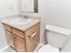 Bathroom vanity featuring a mirror, sink, faucet, and storage cabinet at 12243 Belfry Dr, Noblesville, IN 46060