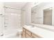 Bright bathroom with a bathtub and shower combo, a white sink, and tan cabinets at 12243 Belfry Dr, Noblesville, IN 46060