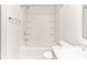 Bright bathroom featuring a tiled bath and shower combo and a single sink vanity at 12243 Belfry Dr, Noblesville, IN 46060
