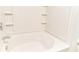 Close up of a tiled bathtub and shower combo at 12243 Belfry Dr, Noblesville, IN 46060