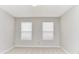 Spacious bedroom with carpet, neutral paint, ceiling light, and two windows at 12243 Belfry Dr, Noblesville, IN 46060