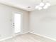 Bright dining area with wood-look floors and a white door offering plenty of natural light at 12243 Belfry Dr, Noblesville, IN 46060