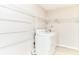 Bright laundry room featuring white washer and dryer units plus plenty of shelving space at 12243 Belfry Dr, Noblesville, IN 46060