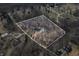 Overhead view of house showing surrounding area including other houses, a pond, and roads at 1285 W Judson Ln, Mooresville, IN 46158