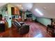 Bonus room featuring hardwood floors, a recliner, a flat-screen TV and a skylight for natural lighting at 1285 W Judson Ln, Mooresville, IN 46158