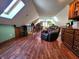 Bonus room featuring hardwood floors, a recliner, a skylight and a vintage stair railing at 1285 W Judson Ln, Mooresville, IN 46158