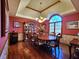 Elegant dining room with tray ceilings, hardwood floors, and arched window at 1285 W Judson Ln, Mooresville, IN 46158