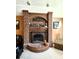 Close-up of a brick fireplace with decorative accents and arched design at 1285 W Judson Ln, Mooresville, IN 46158