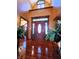 Grand foyer with high ceilings, hardwood floors, and a decorative front door at 1285 W Judson Ln, Mooresville, IN 46158