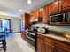 Gourmet kitchen with granite countertops, stainless steel appliances, and custom wood cabinetry at 1285 W Judson Ln, Mooresville, IN 46158