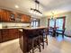 Kitchen island with seating, stainless appliances, granite countertops, and view to dining area at 1285 W Judson Ln, Mooresville, IN 46158