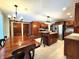 Large kitchen and dining area with wood cabinets, stainless steel appliances, island with seating at 1285 W Judson Ln, Mooresville, IN 46158