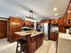 Spacious kitchen with dark wood cabinets, stainless steel appliances, and granite countertops at 1285 W Judson Ln, Mooresville, IN 46158