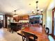 Open kitchen and dining area with wood cabinets, stainless appliances, and lots of natural light at 1285 W Judson Ln, Mooresville, IN 46158