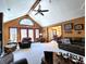 Bright living room featuring high ceilings, a ceiling fan, and a door leading to the outside at 1285 W Judson Ln, Mooresville, IN 46158