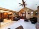 Inviting living room with fireplace, wood flooring, and seamless access to kitchen and foyer at 1285 W Judson Ln, Mooresville, IN 46158