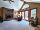 Living room with brick fireplace, vaulted ceilings, and an abundance of natural light at 1285 W Judson Ln, Mooresville, IN 46158