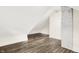 Finished attic with exposed brickwork and hardwood flooring at 1304 N Tuxedo St, Indianapolis, IN 46201