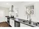 Bright kitchen featuring stainless steel appliances, sleek countertops and white cabinets at 1304 N Tuxedo St, Indianapolis, IN 46201