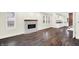 Sunlit space featuring sleek flooring and a unique fireplace near kitchen at 1304 N Tuxedo St, Indianapolis, IN 46201