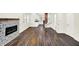 Spacious interior view showing the fireplace, new flooring, and flowing floor plan at 1304 N Tuxedo St, Indianapolis, IN 46201