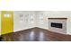 Inviting space with large windows, unique fireplace and stylish, sleek flooring at 1304 N Tuxedo St, Indianapolis, IN 46201