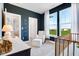 Well-lit Bedroom featuring a crib, chair, and large windows, creating a welcoming and soothing environment at 13383 Vickery Ridge Dr, Fishers, IN 46037