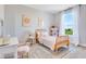 Charming bedroom with a vintage-inspired bed, a bright window, and delightful decor accents at 13383 Vickery Ridge Dr, Fishers, IN 46037